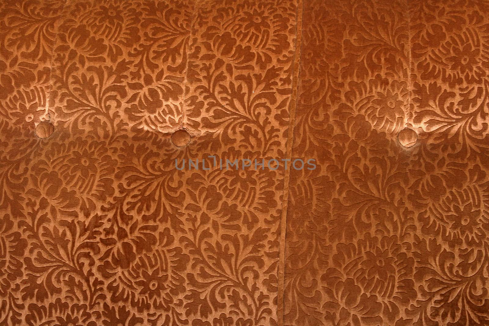 abstract retro golden velvet textile detail with butons from couch 
