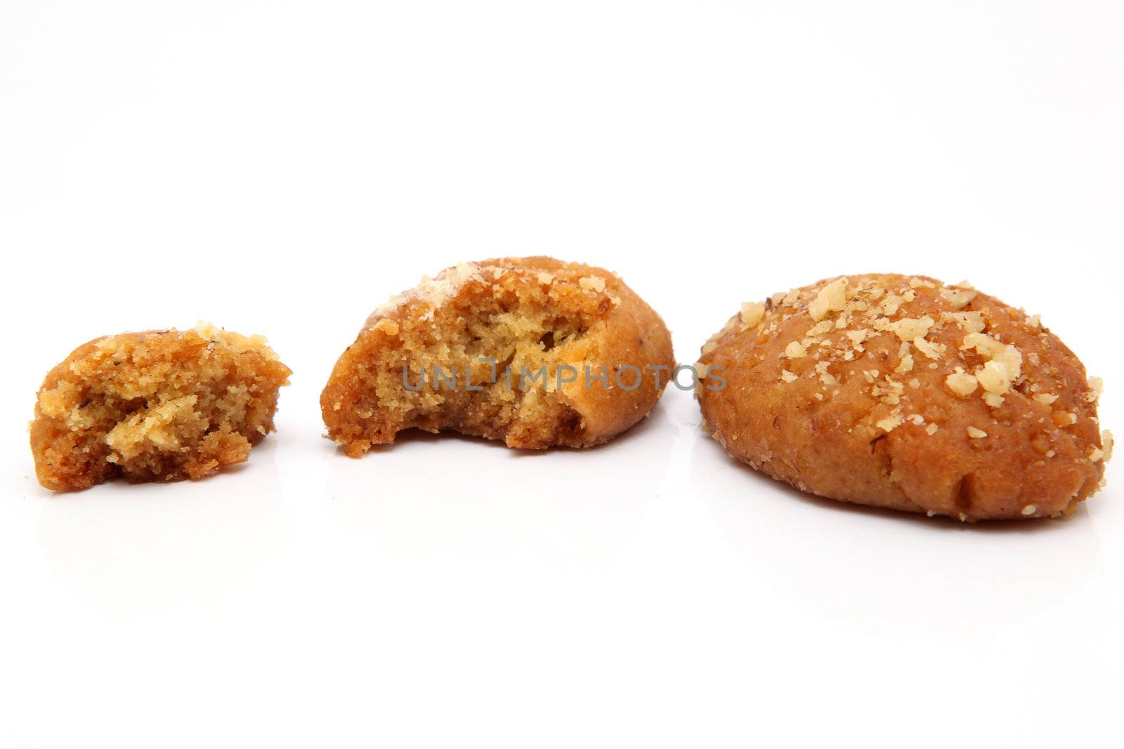 two traditional Greek Christmas sweets called melomakarona or phoenikia. A honey-dipped cookie, with wallnuts on top