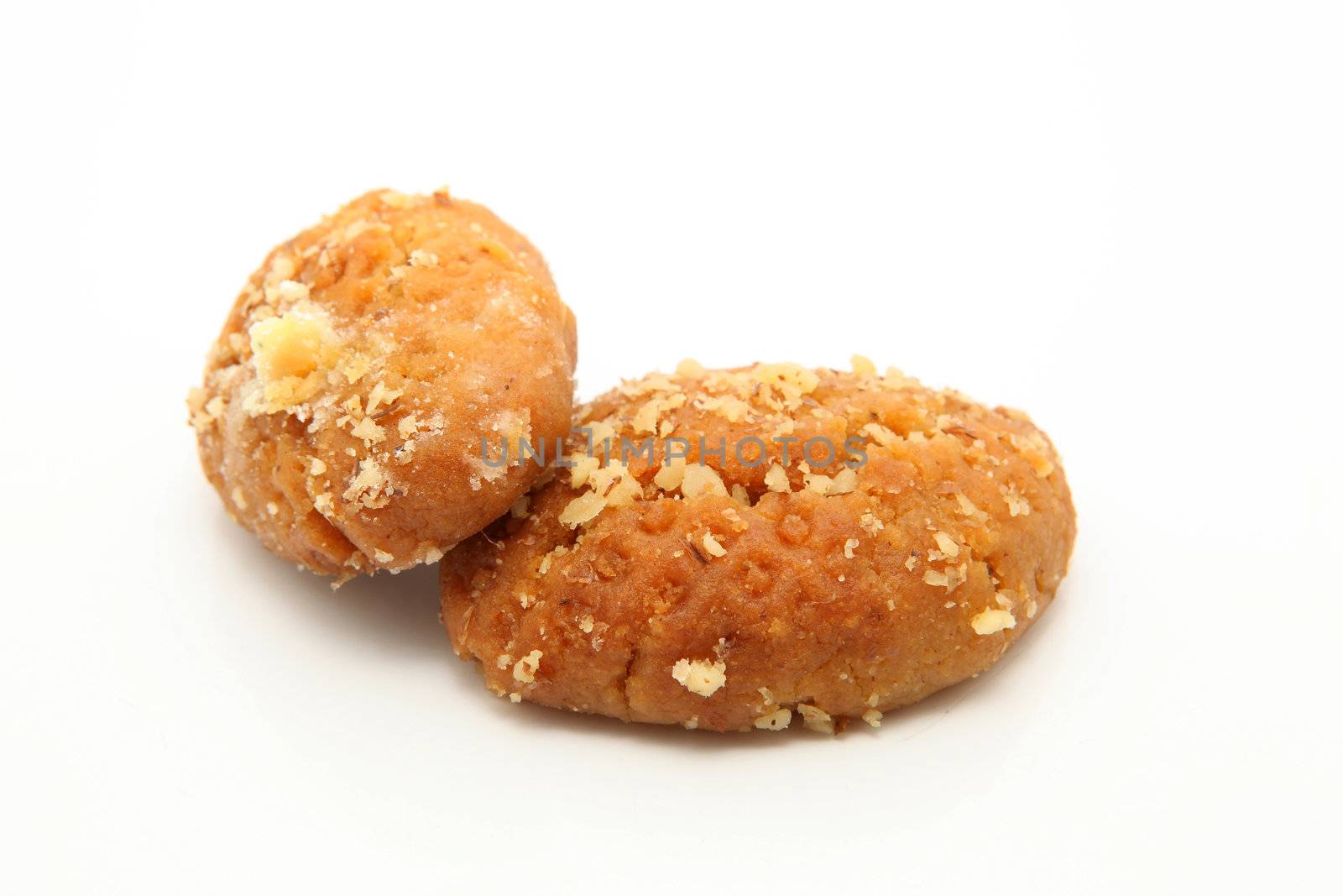two traditional Greek Christmas sweets called melomakarona or phoenikia. A honey-dipped cookie, with wallnuts on top