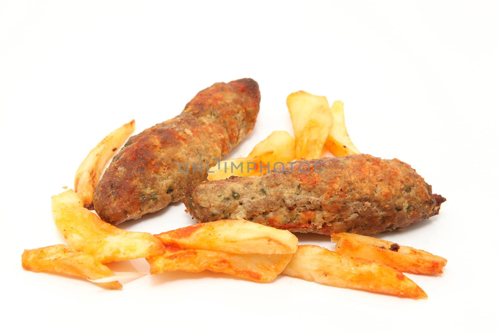 fried potatos and two stakes isolated on white background
