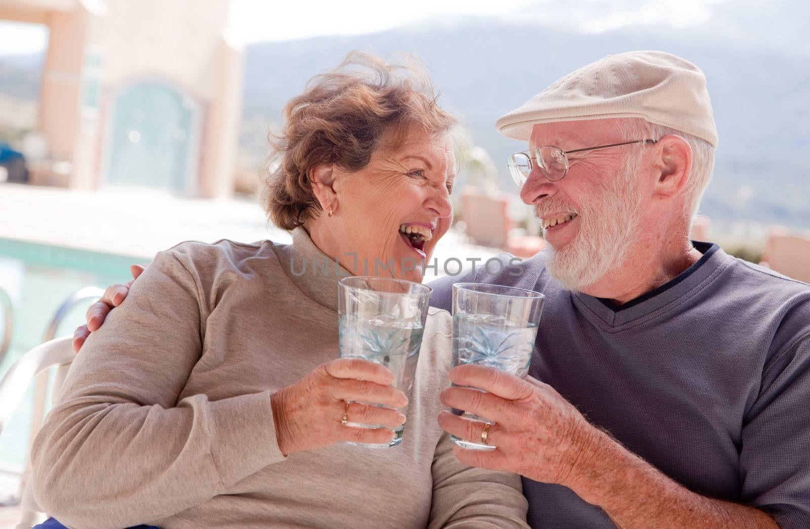Happy Senior Adult Couple Enjoying Drinks Together.