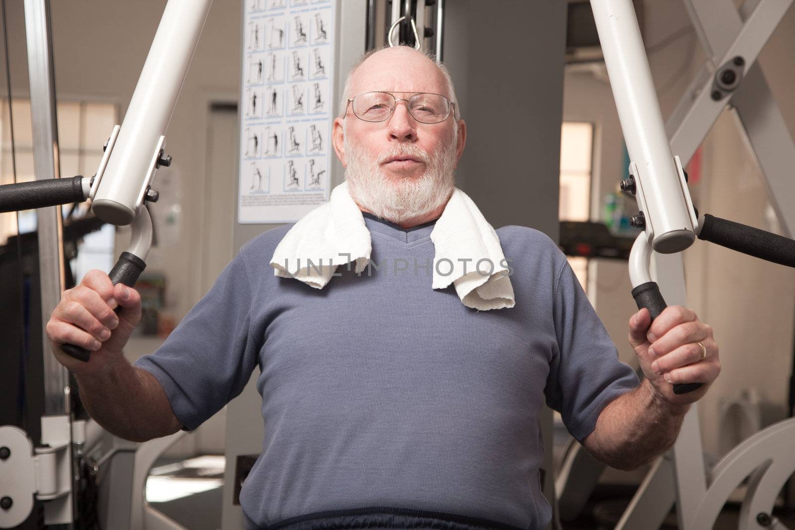 Senior Adult Man Working Out in the Gym.