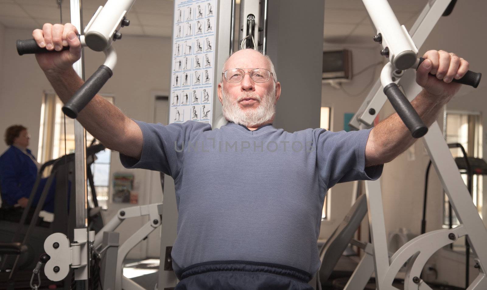 Senior Adult Man Working Out in the Gym.