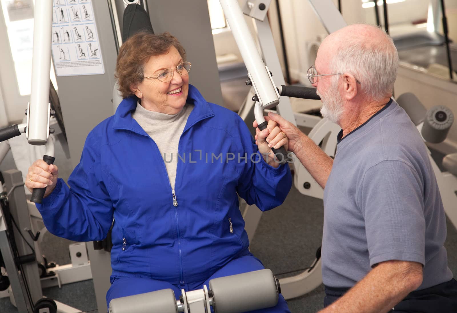 Senior Adult Couple Working Out in the Gym.