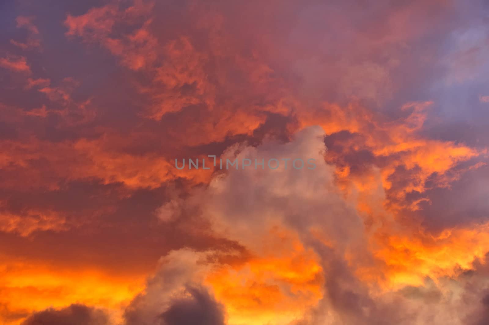 A jumble of stratocumulus clouds at sunset. Suitable as an abstract, natural graphics background.