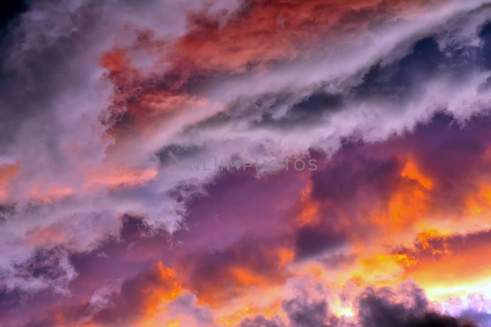 A jumble of stratocumulus clouds at sunset. Suitable as an abstract, natural graphics background.