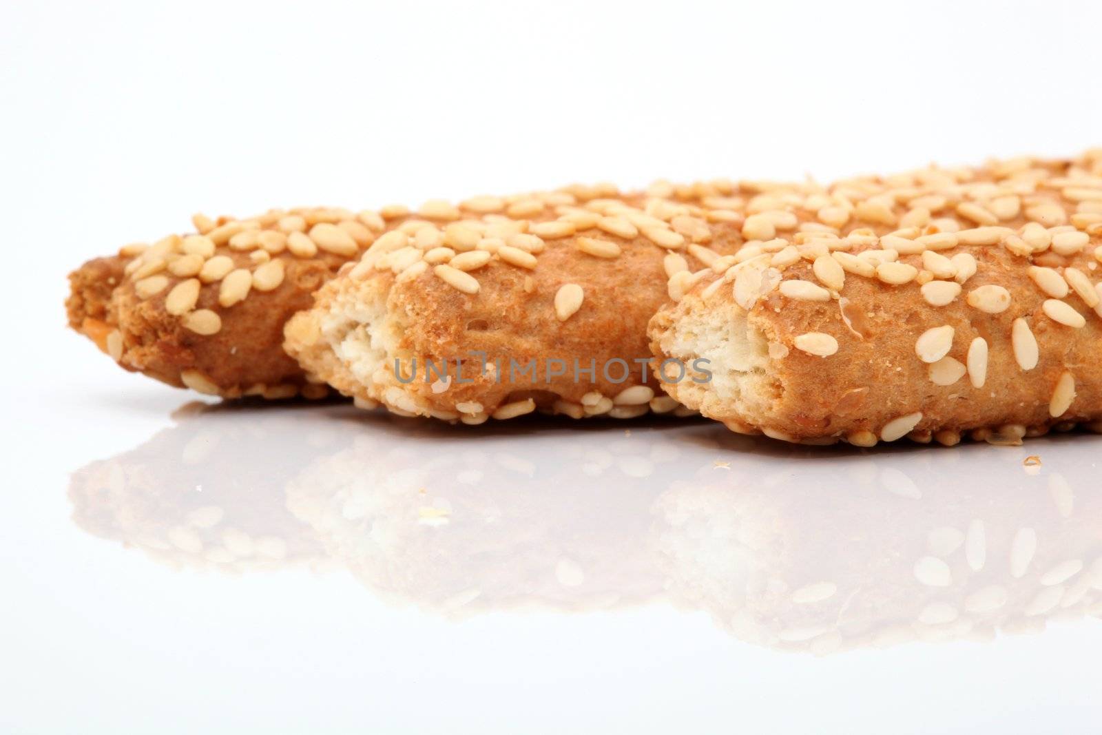 sesame bagel closeup with reflection isolated food concepts