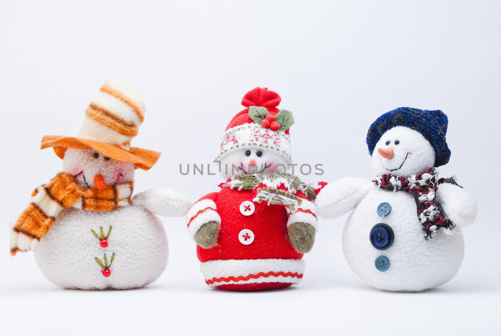 Three Christmas Snowmen on a white background.