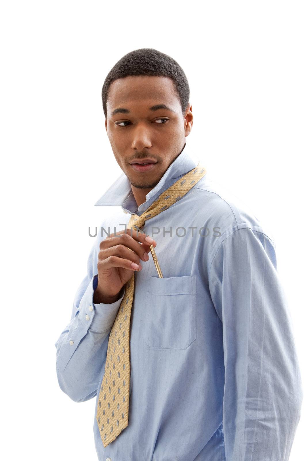 Handsome African American male in blue shirt and yellow tie putting pen in pocket, isolated