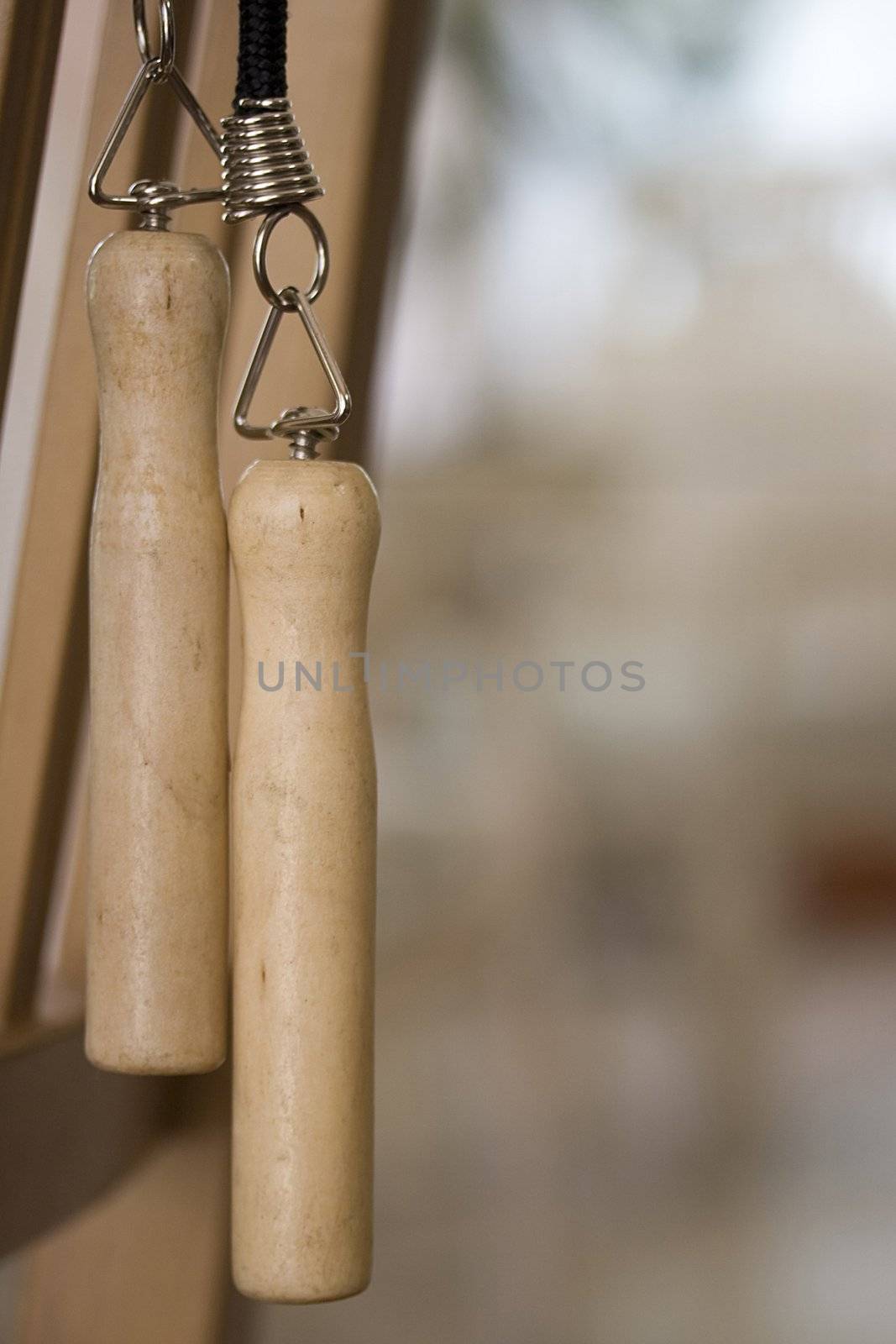 Close-up of two wooden jump rope handles.