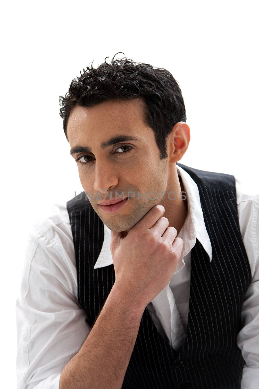 Handsome male wearing a white shirt and black pinstripe vest and hand under chin, isolated