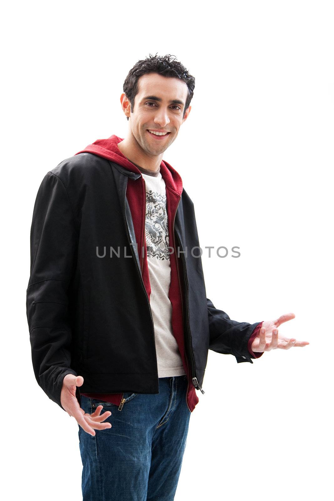 Cool handsome male smiling wearing a red hoodie, black coat and jeans, with hands open, isolated
