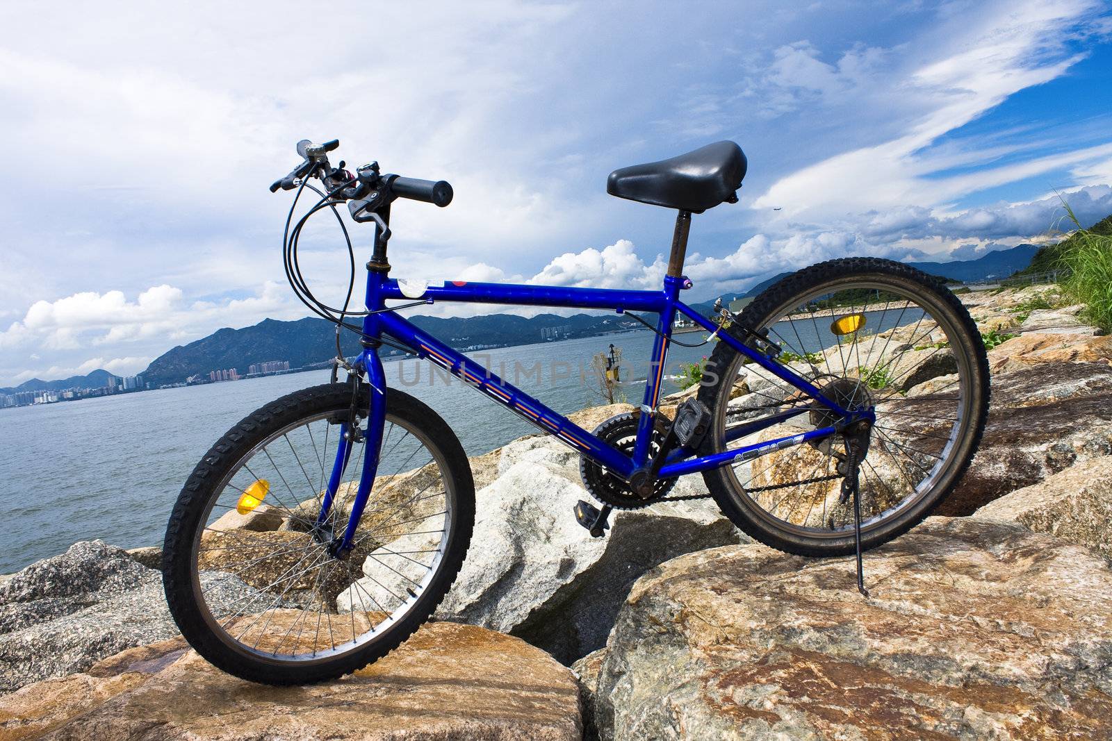 bike in the sea bay and blue sky