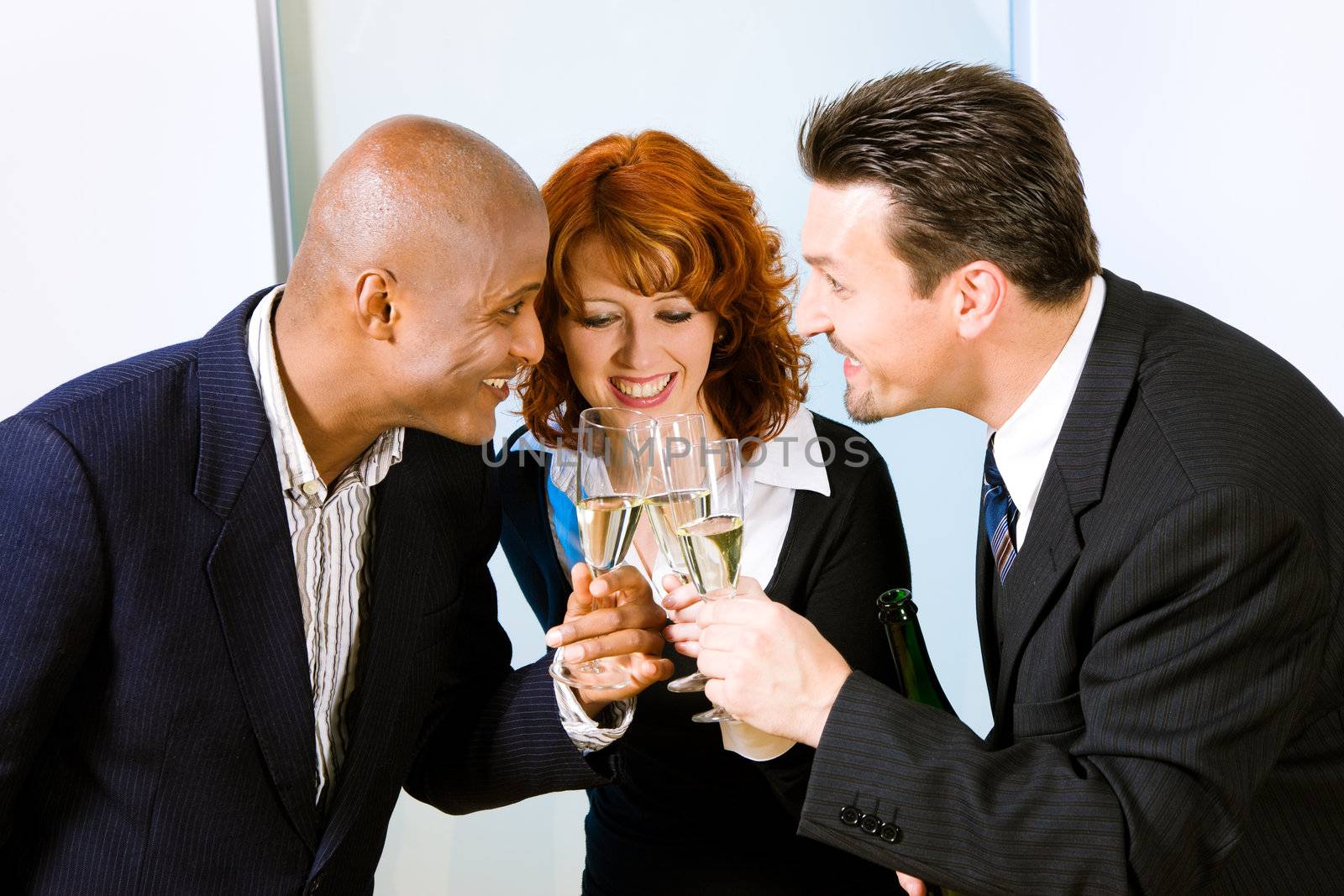 People clinking their glasses of champagne at a reception or party