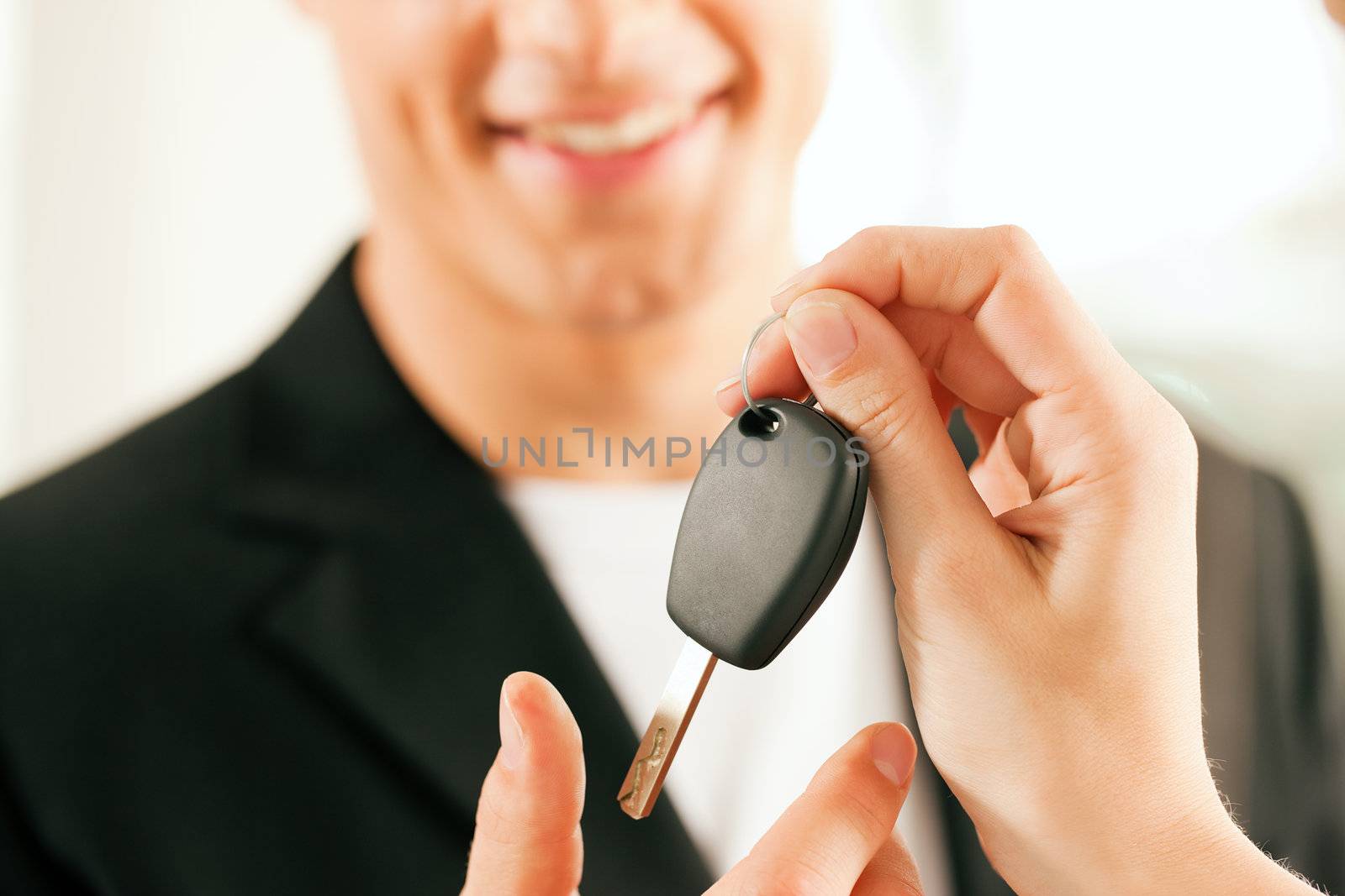 man buying car - key being given by Kzenon