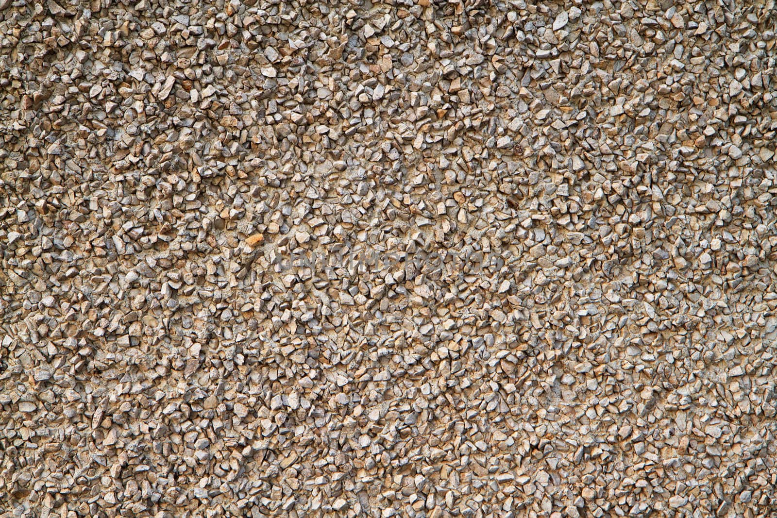 Light brown gravel textured stucco like wall