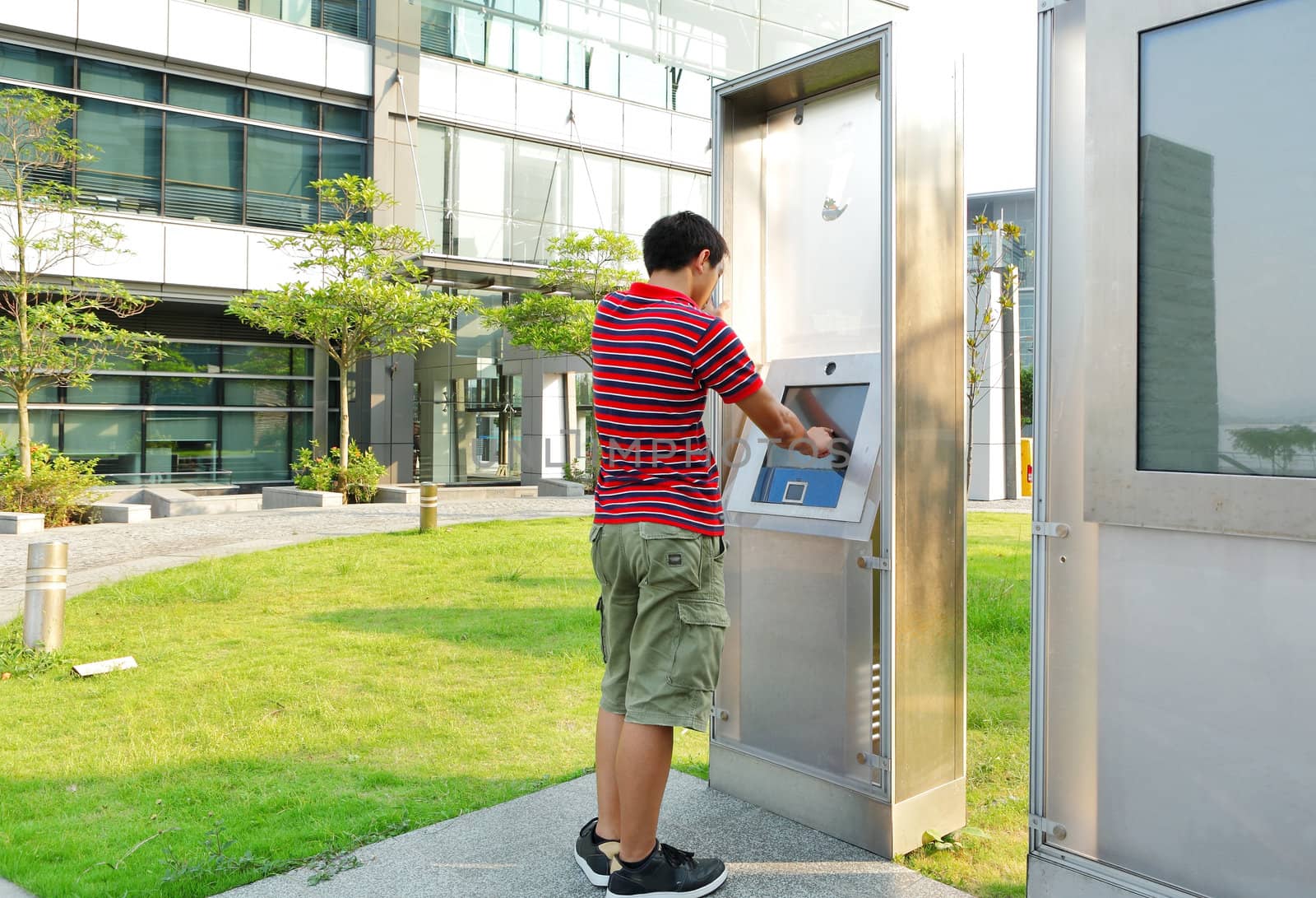 man using touch screen outdoor