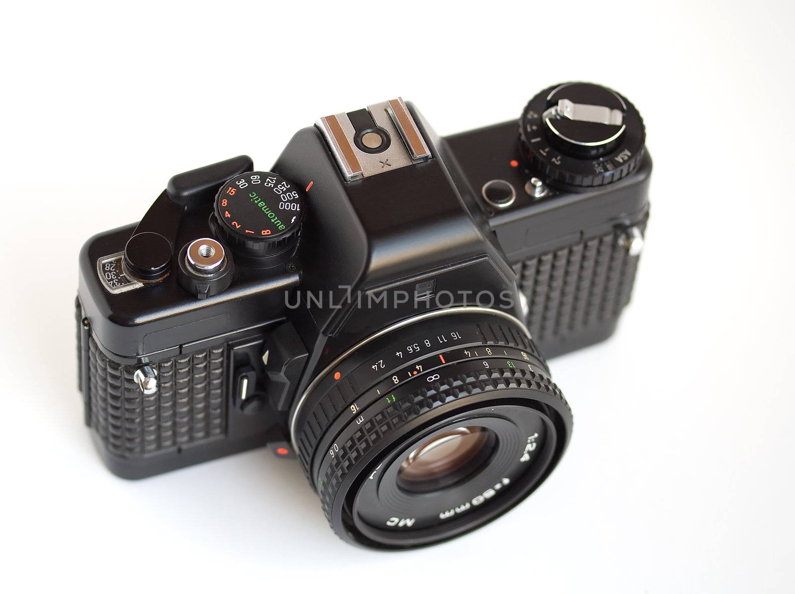 Vintage SLR camera over white bacground by serpl