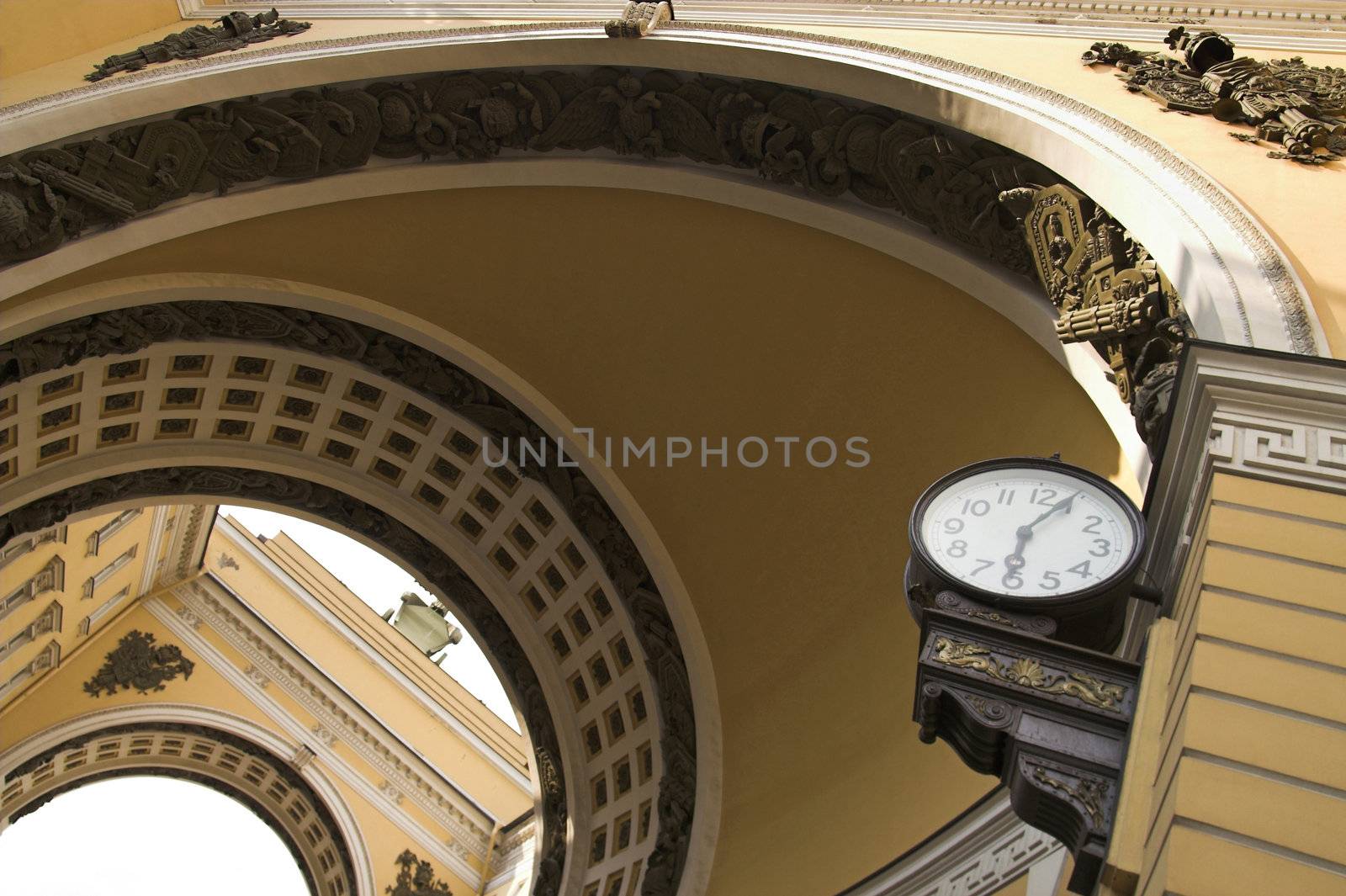 Old-style  public clocks under the General Army Staff Building Arch in Saint Petersburg, Russia.