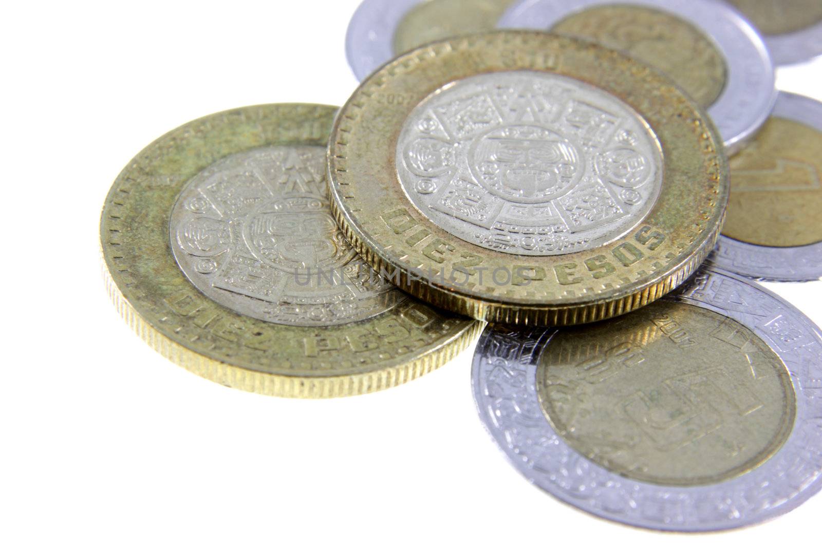 A close-up shot of a bunch of Mexican coins.
