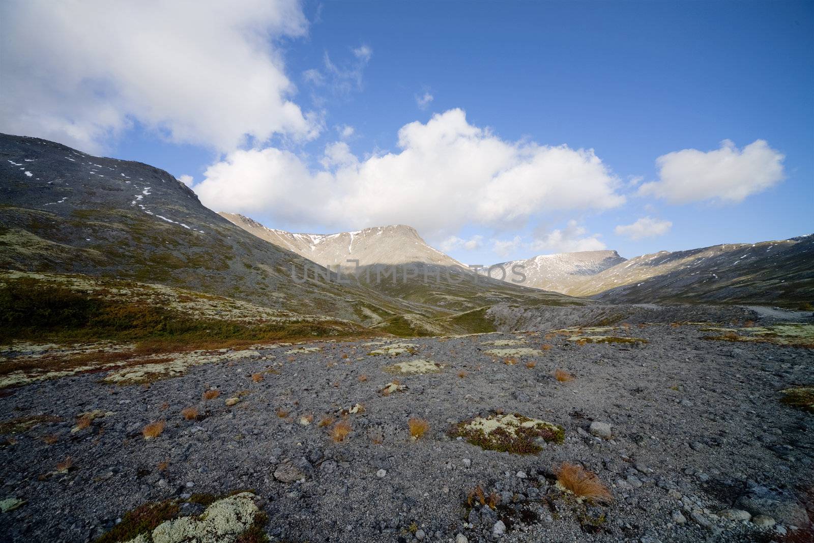 Landscape photographing from mountain peak on sky background