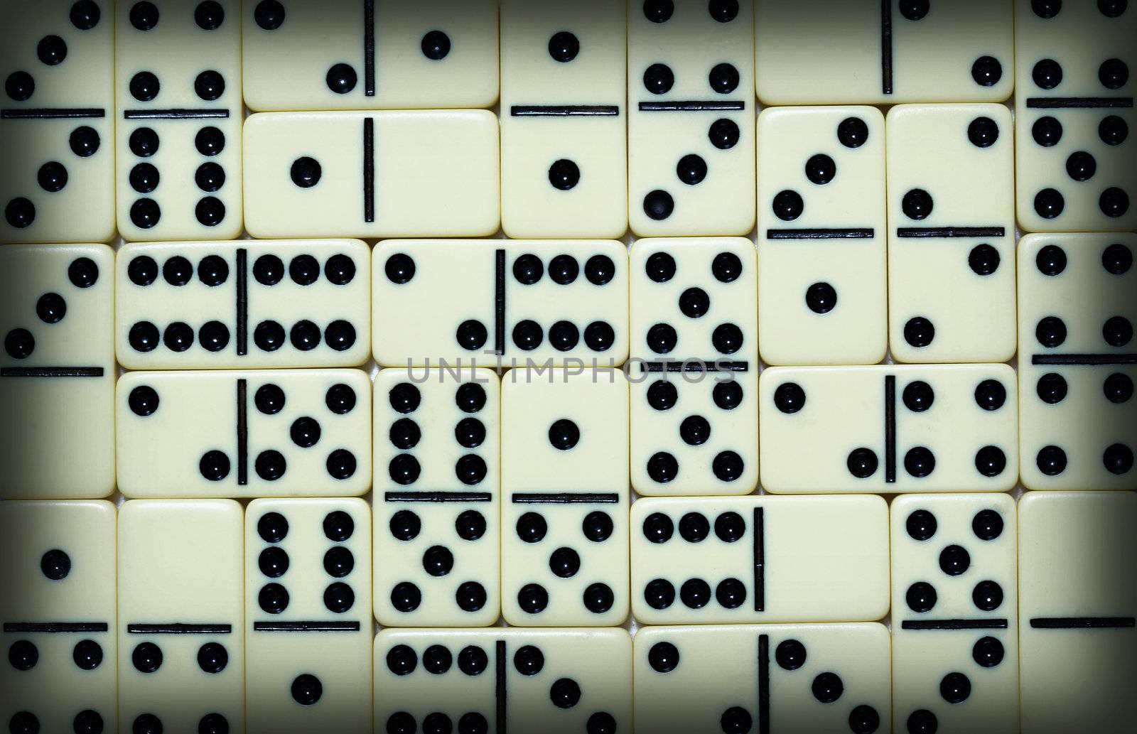 The background from white spotted dominoes pieces