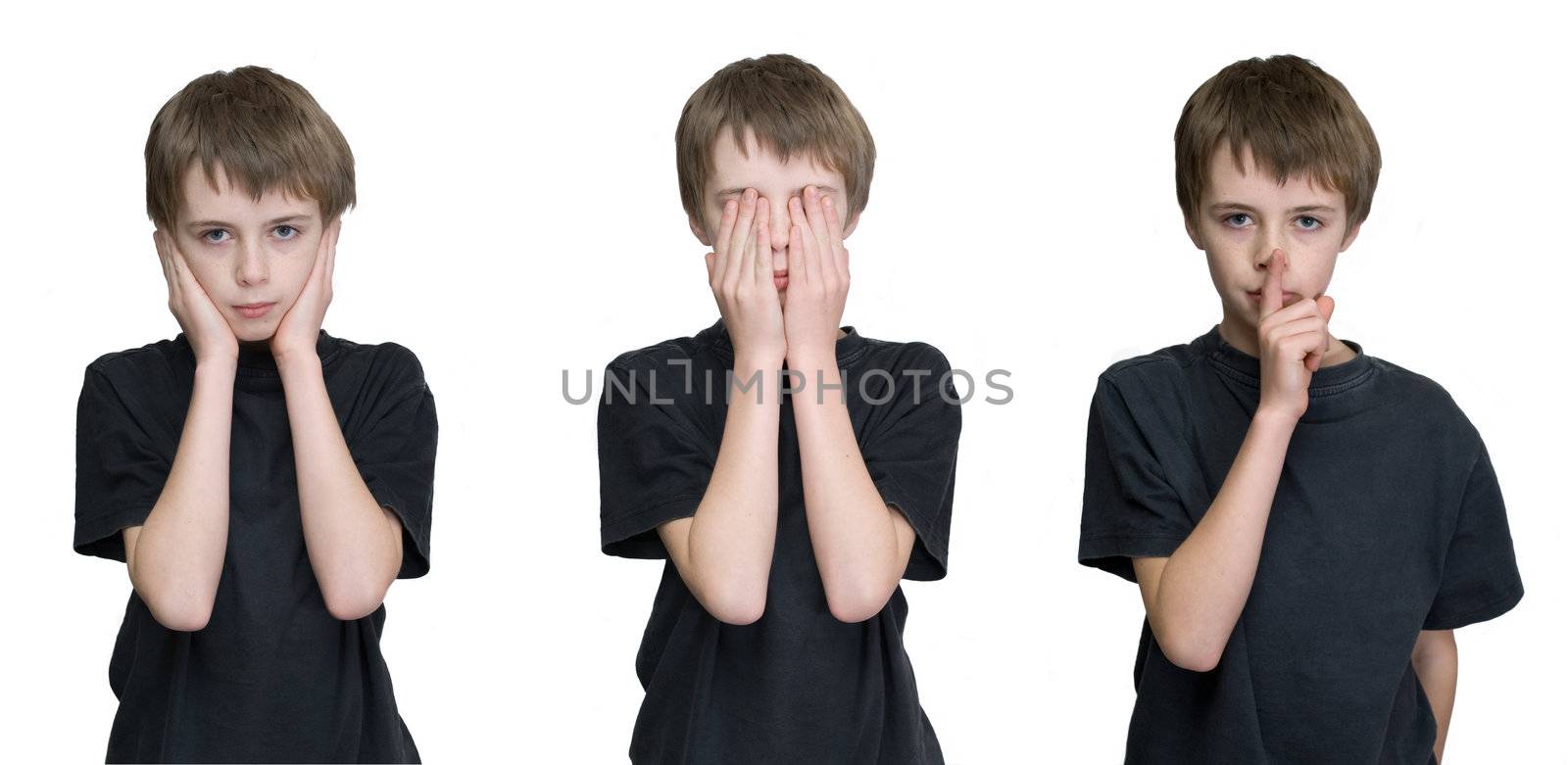 a young male child depicting the three wise monkies old saying hear, see and speak no evil. 