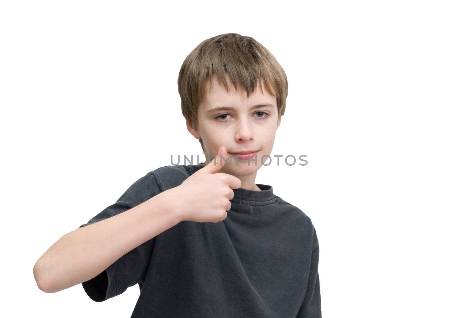 A young boy saying ok with a thumbs up hand sign.