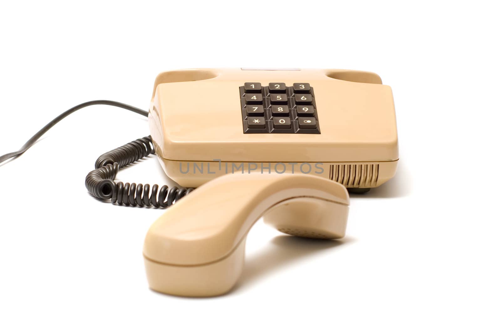 Old telephones with removed receiver isolated on a white background. 