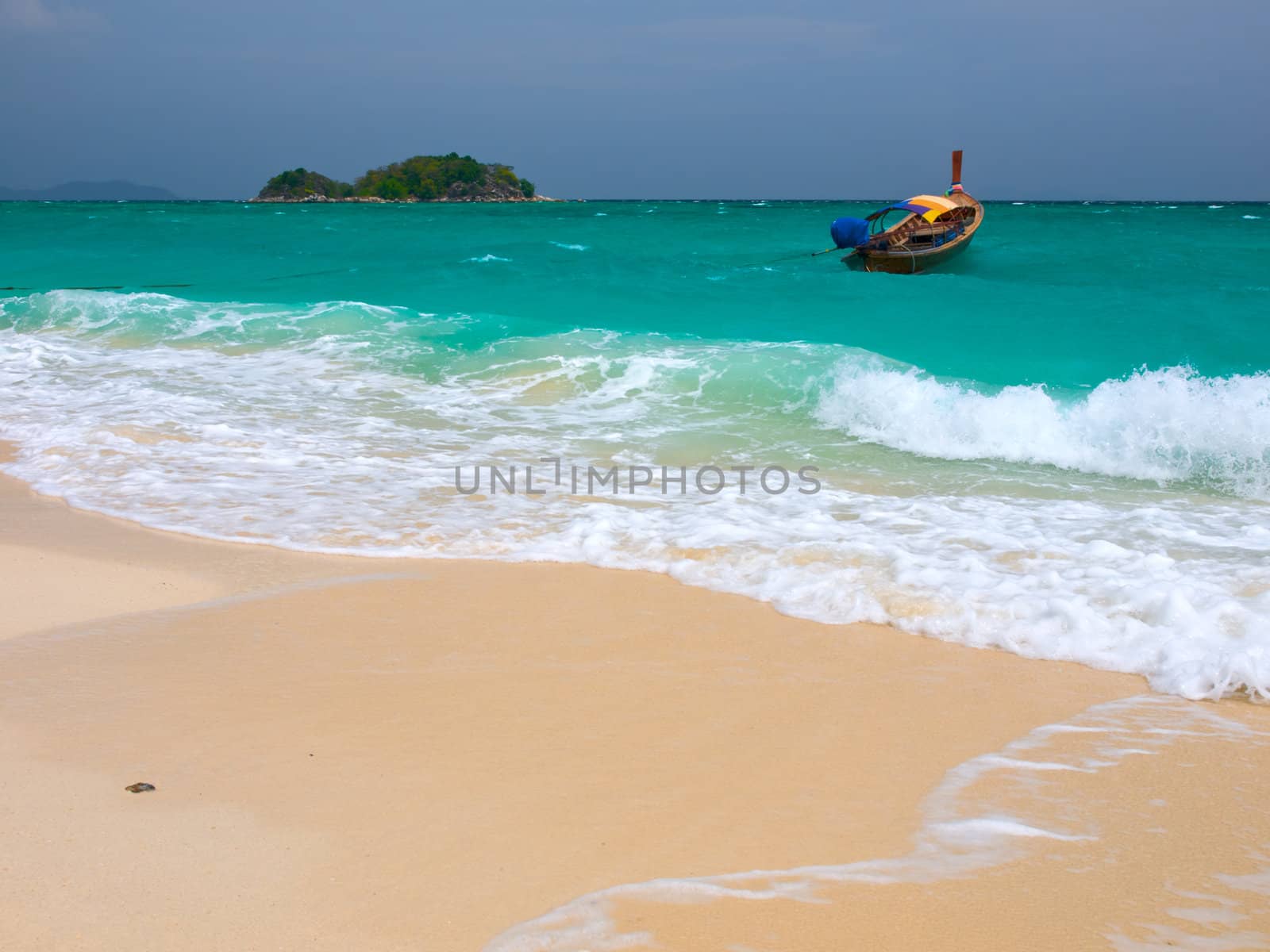 Turquoise sea and yellow sand on a tropical beach