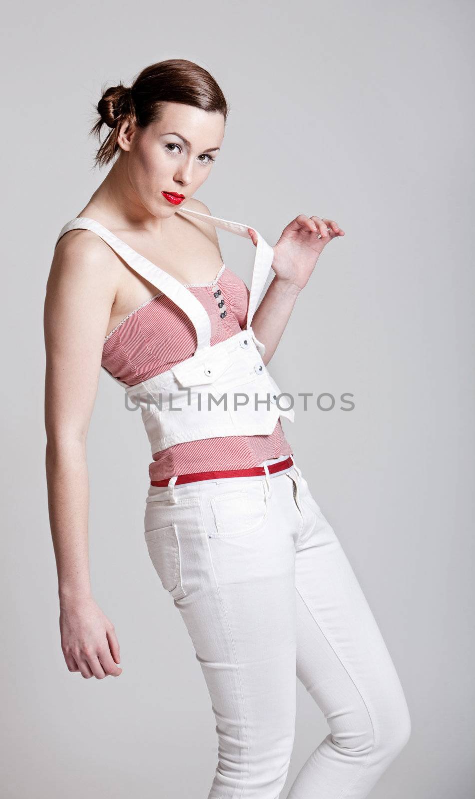 Beautiful girl with white trousers and fashionable clothing