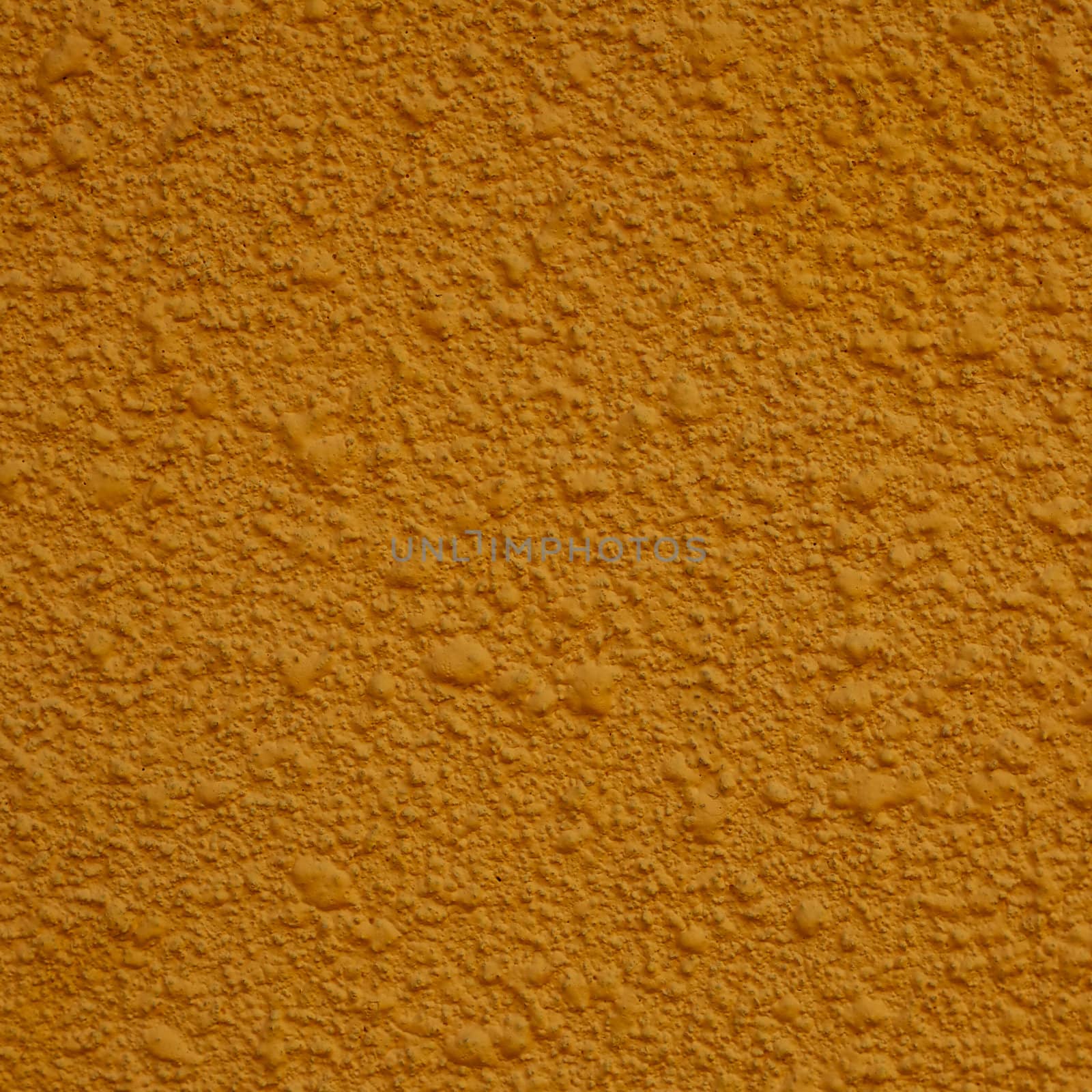 a square of yellow painted stucco