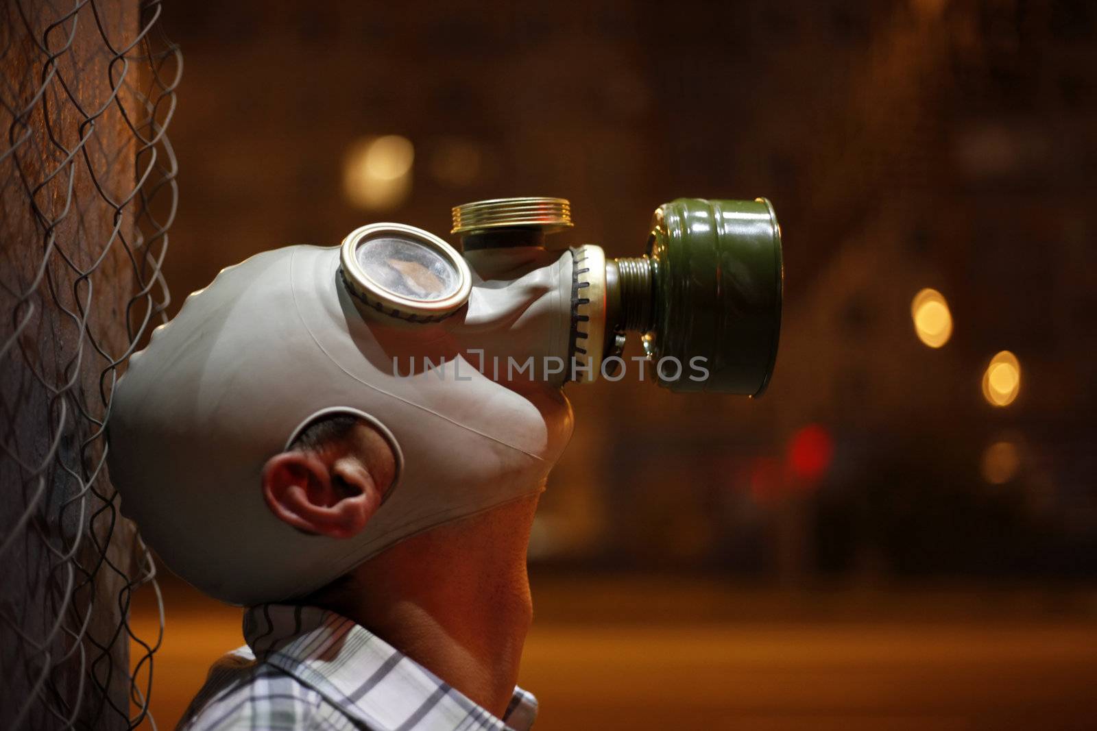 Man in a gas mask on night street