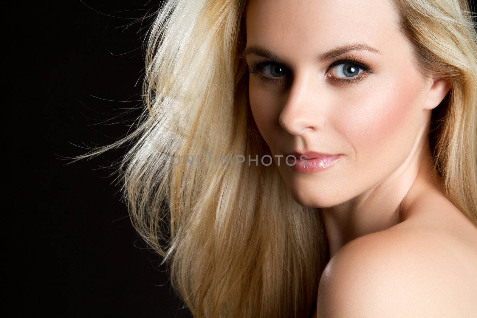 Beautiful blond woman on black