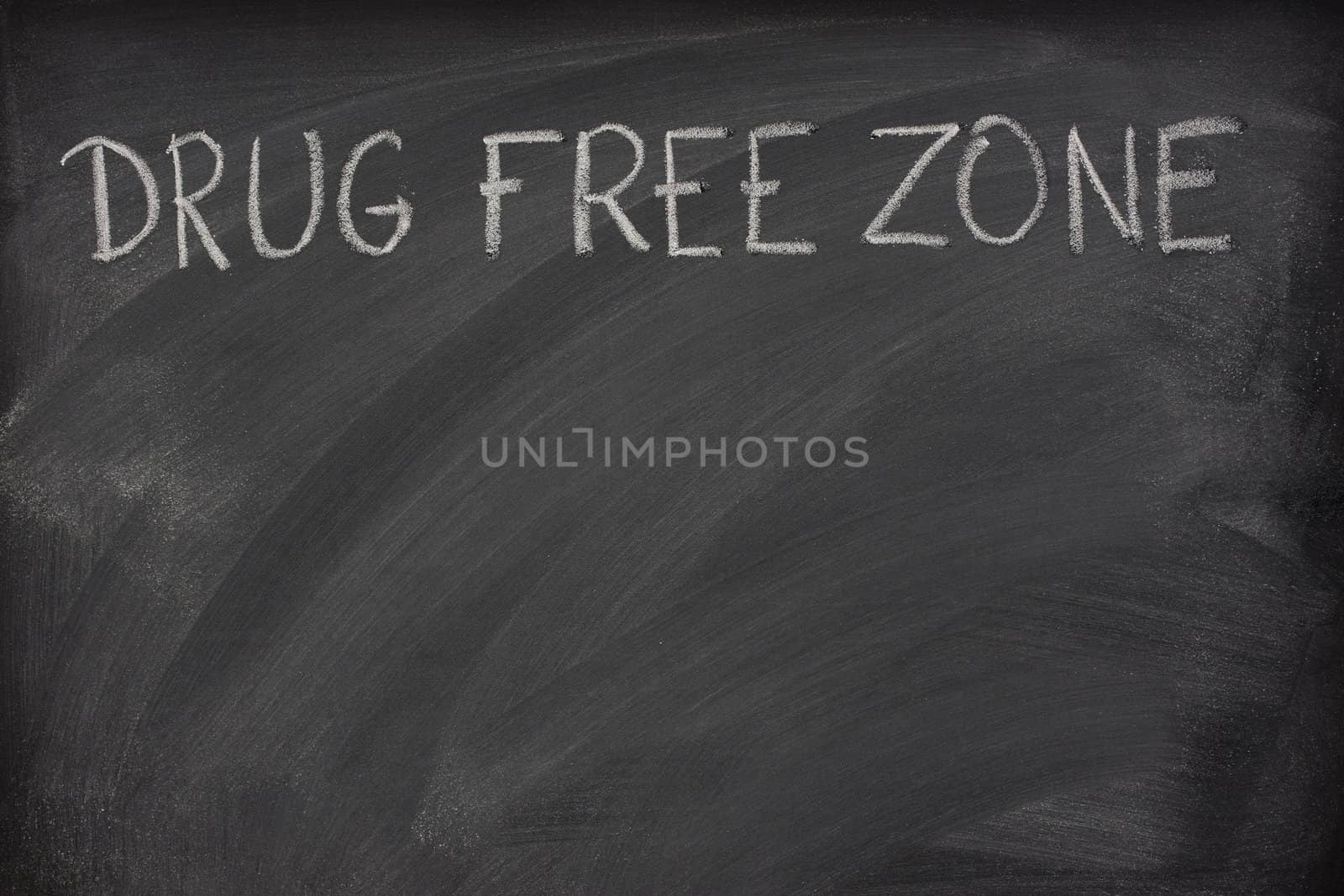 drug free zone text on a school blackboard by PixelsAway