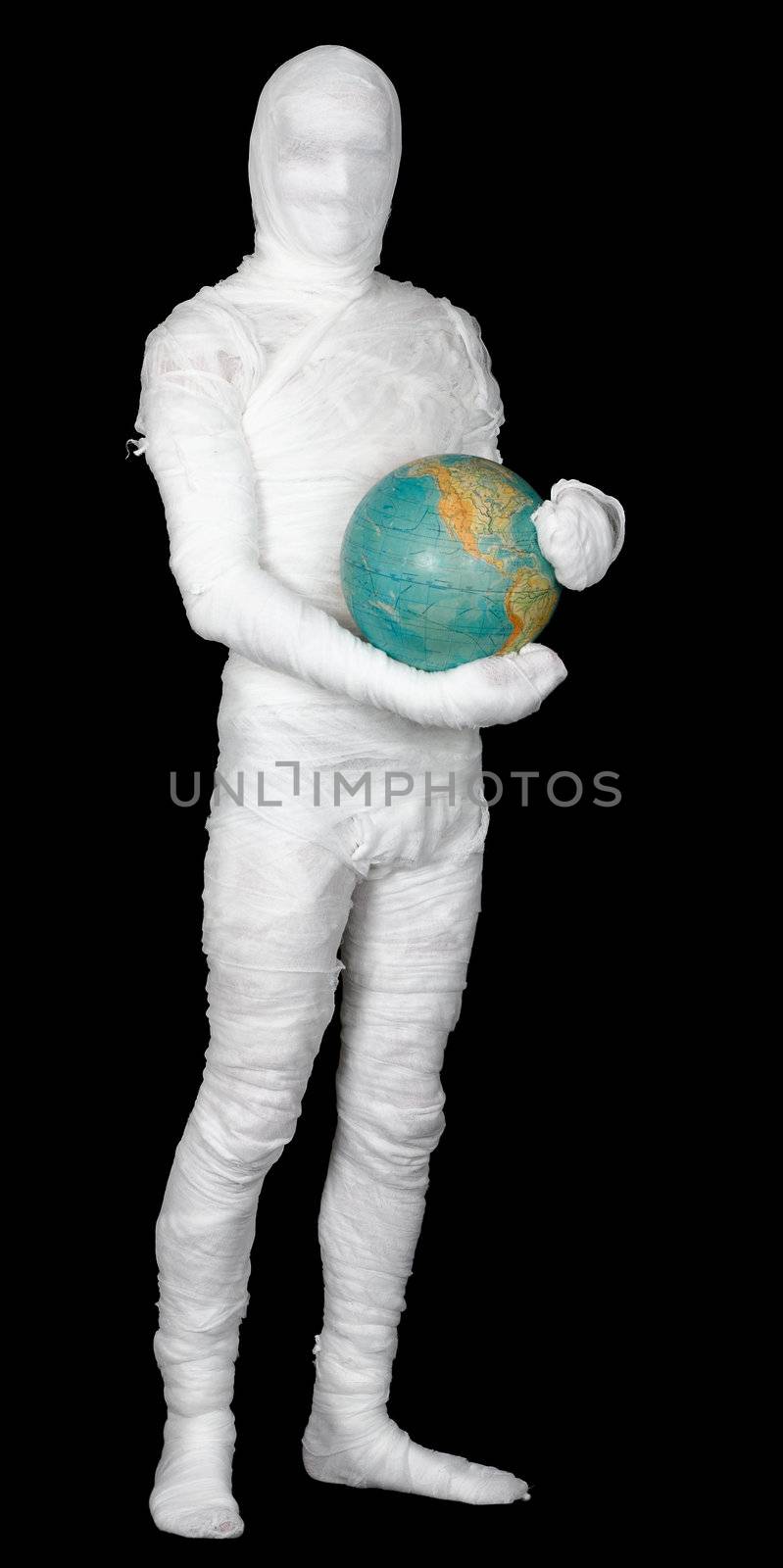 Man in costume mummy and terrestrial globe on black