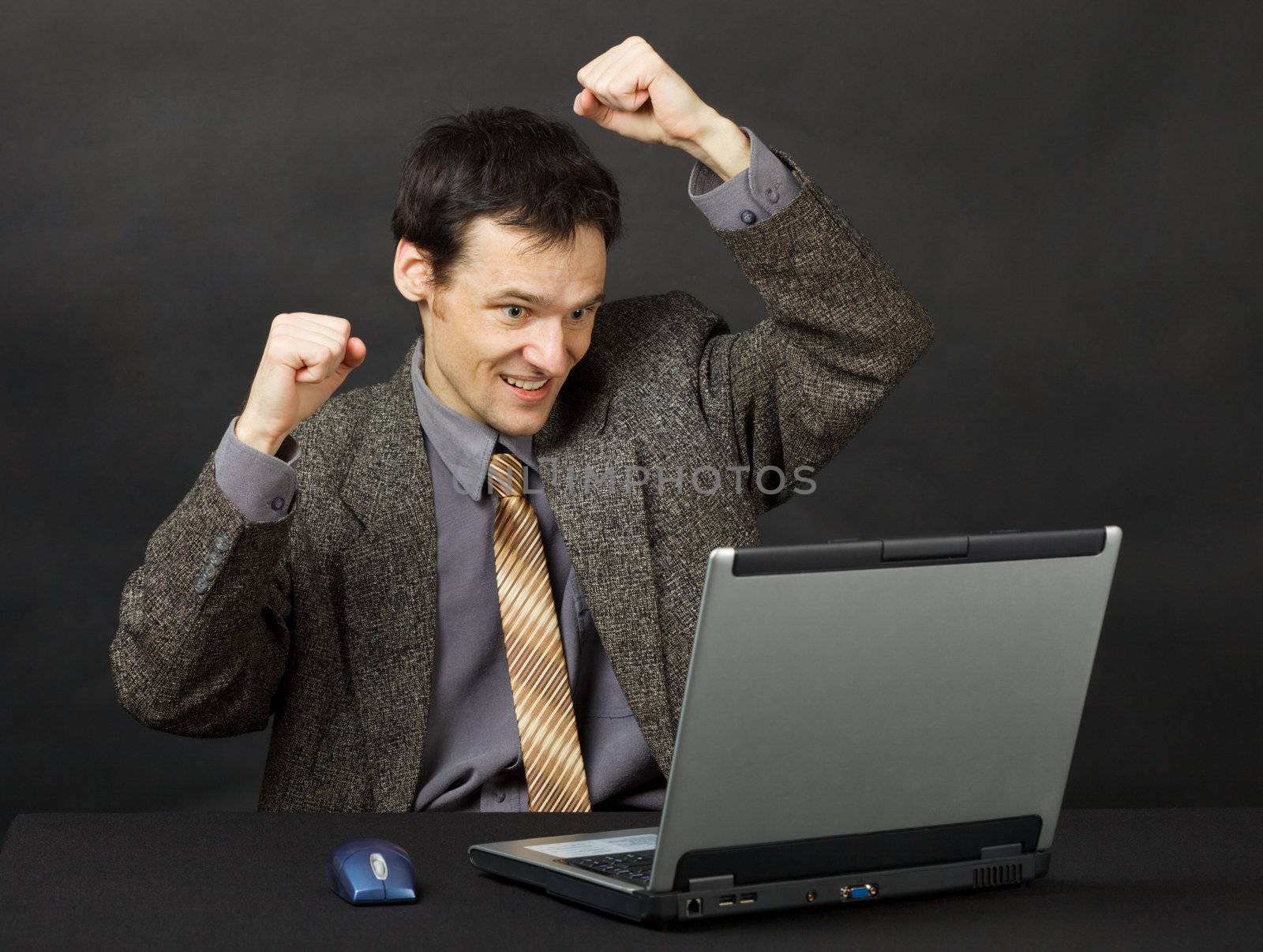 The man - the football fan, watches a football match in the Internet