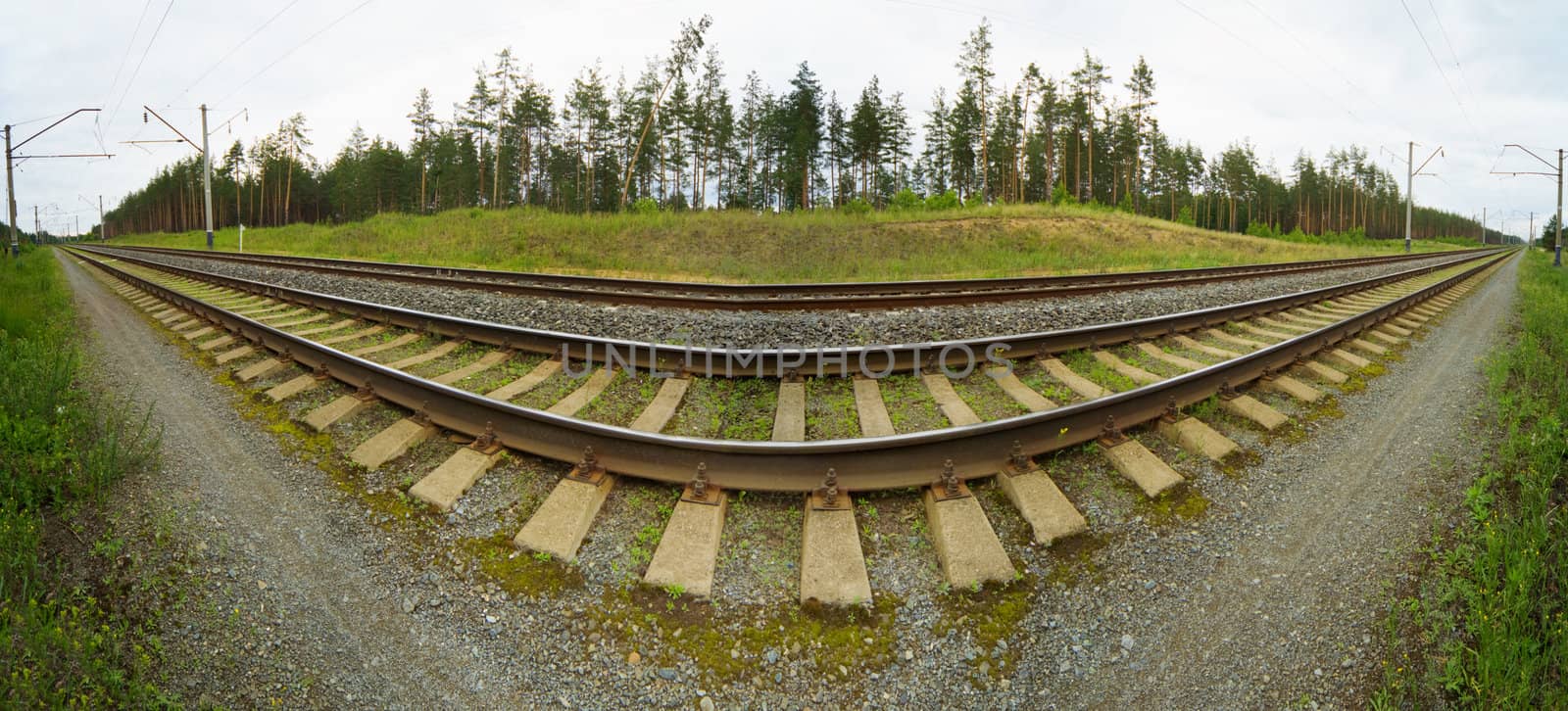 Wide-angle panoramic photo of railroad tracks by pzaxe
