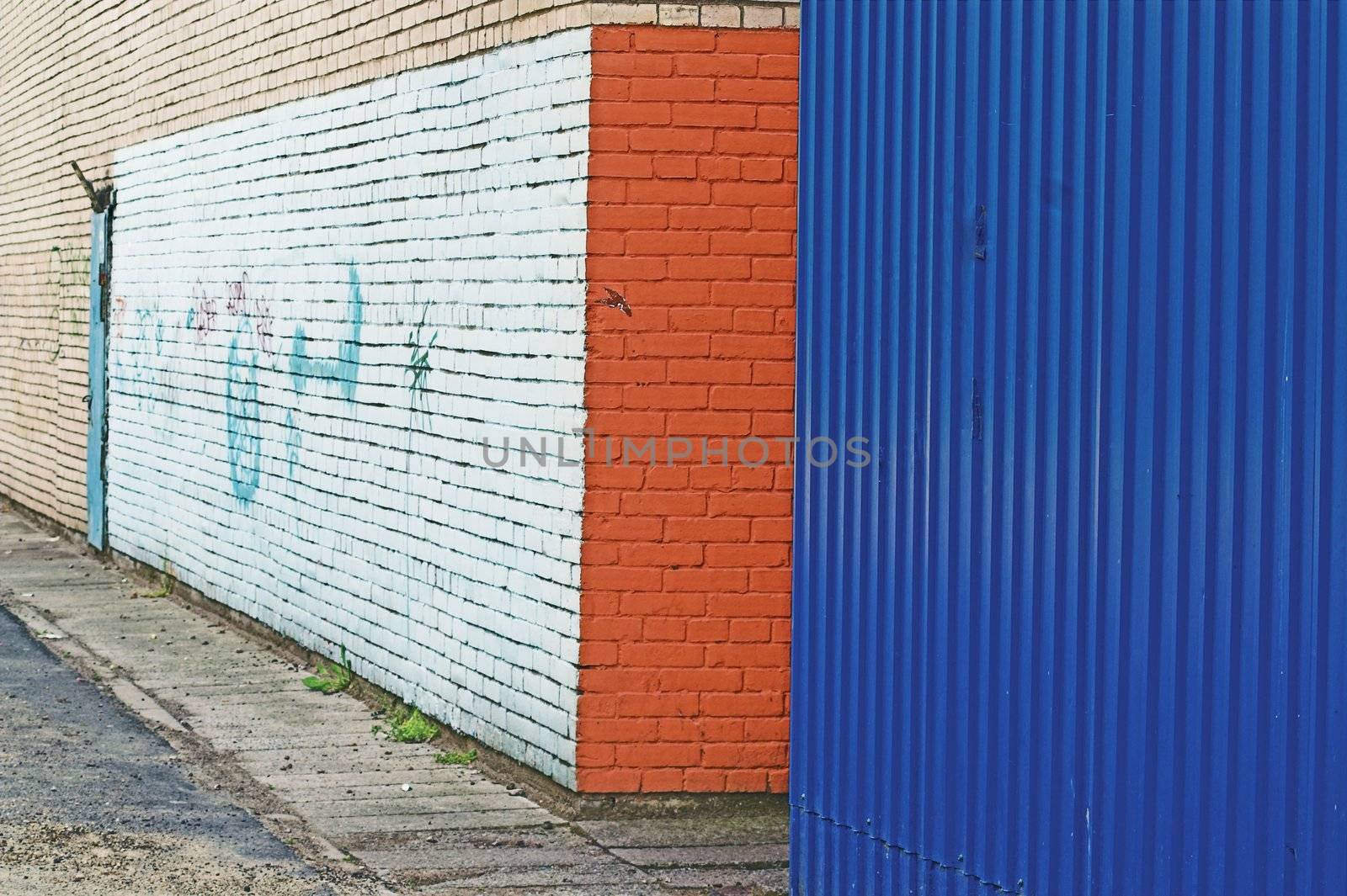 Close-up view of corner and painted wall with graffiti