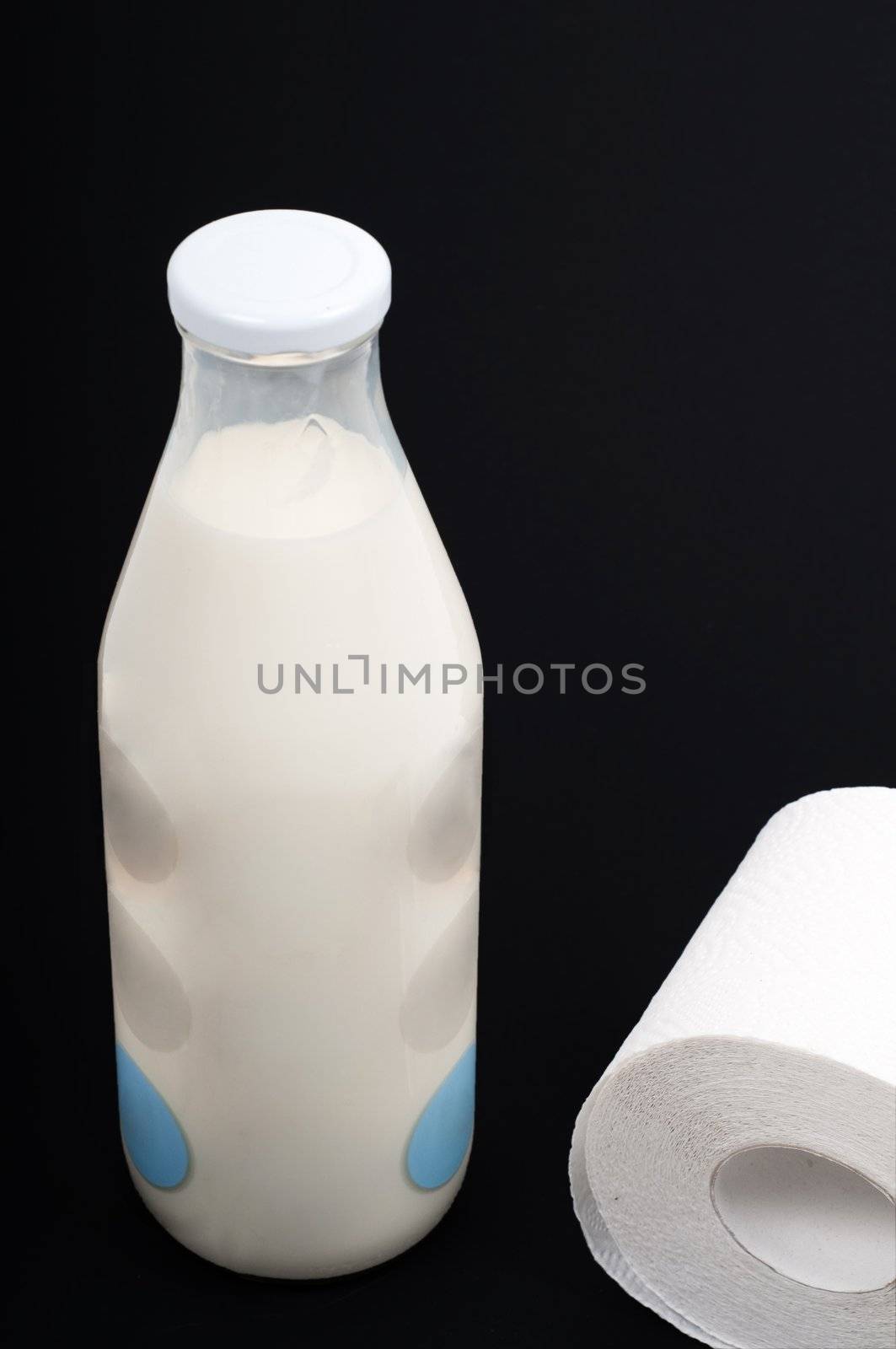 Conceptual photo with milk and wc paper