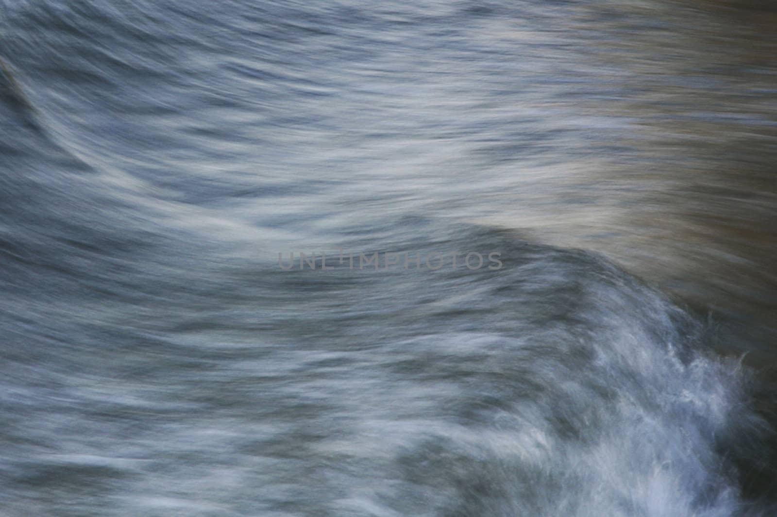 A painterly photo of a wave. Move is captured with long exposure.