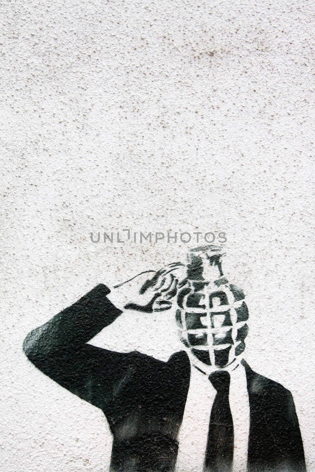 grenade head man black and white grafitti on the wall