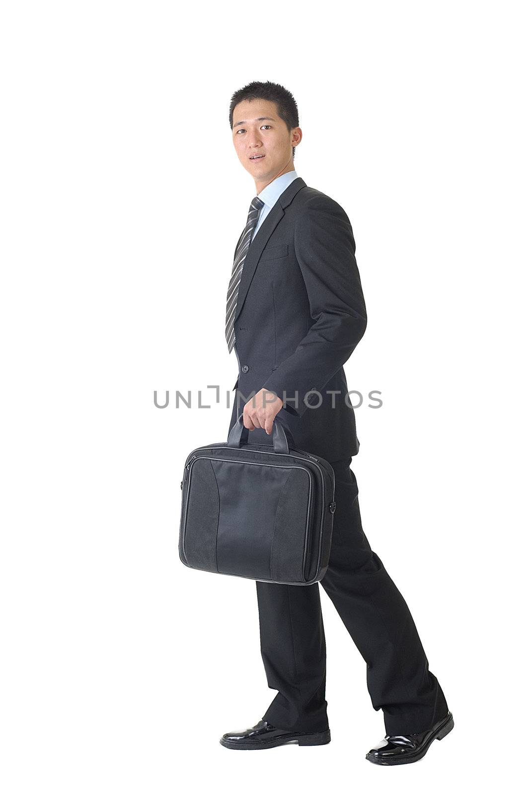 Walking pose of businessman isolated on white background.