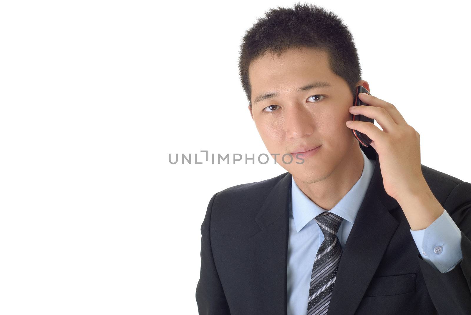 Portrait of young businessman use cellphone with white copyspace.