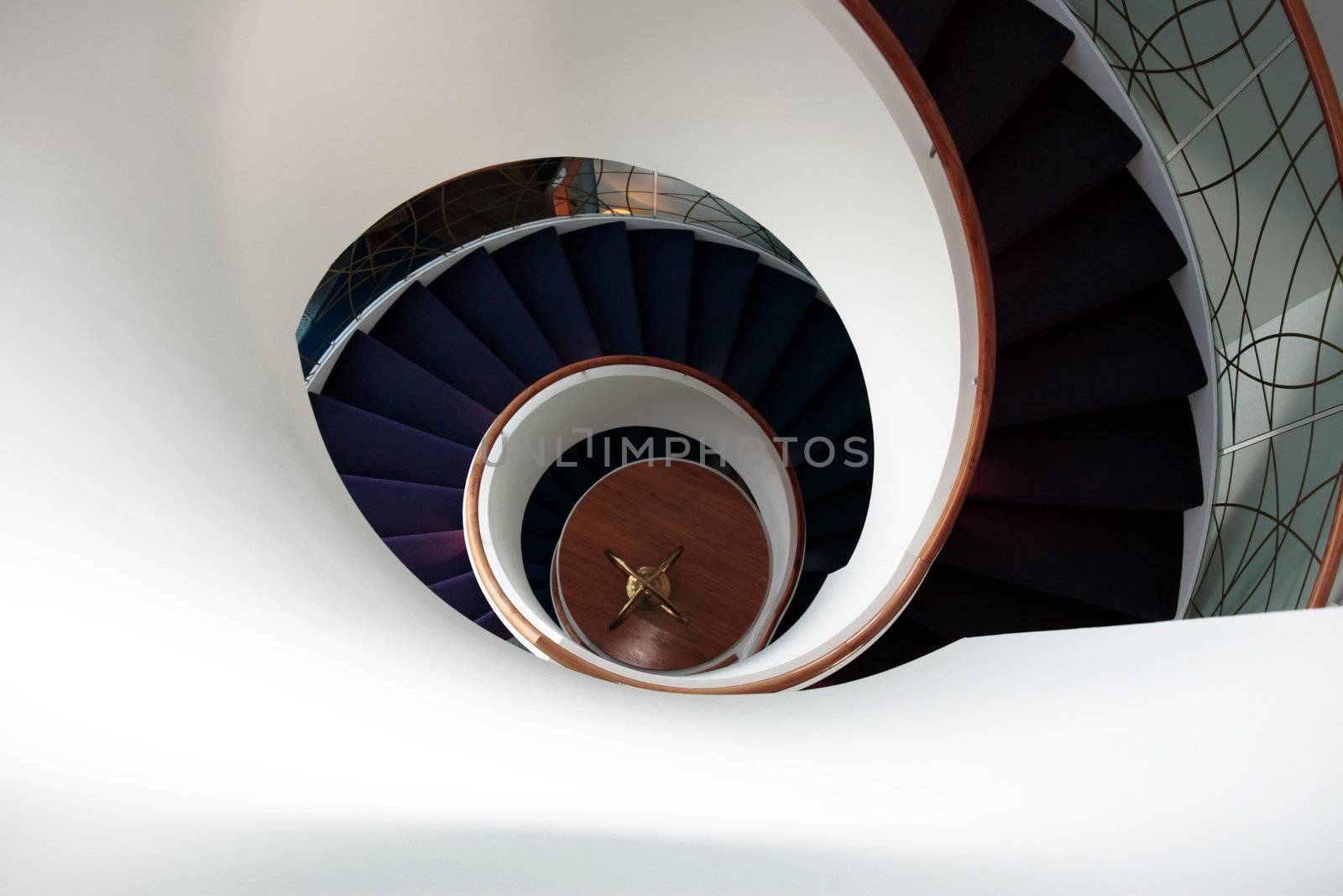 a view down a spiral staircase with room for copyspace