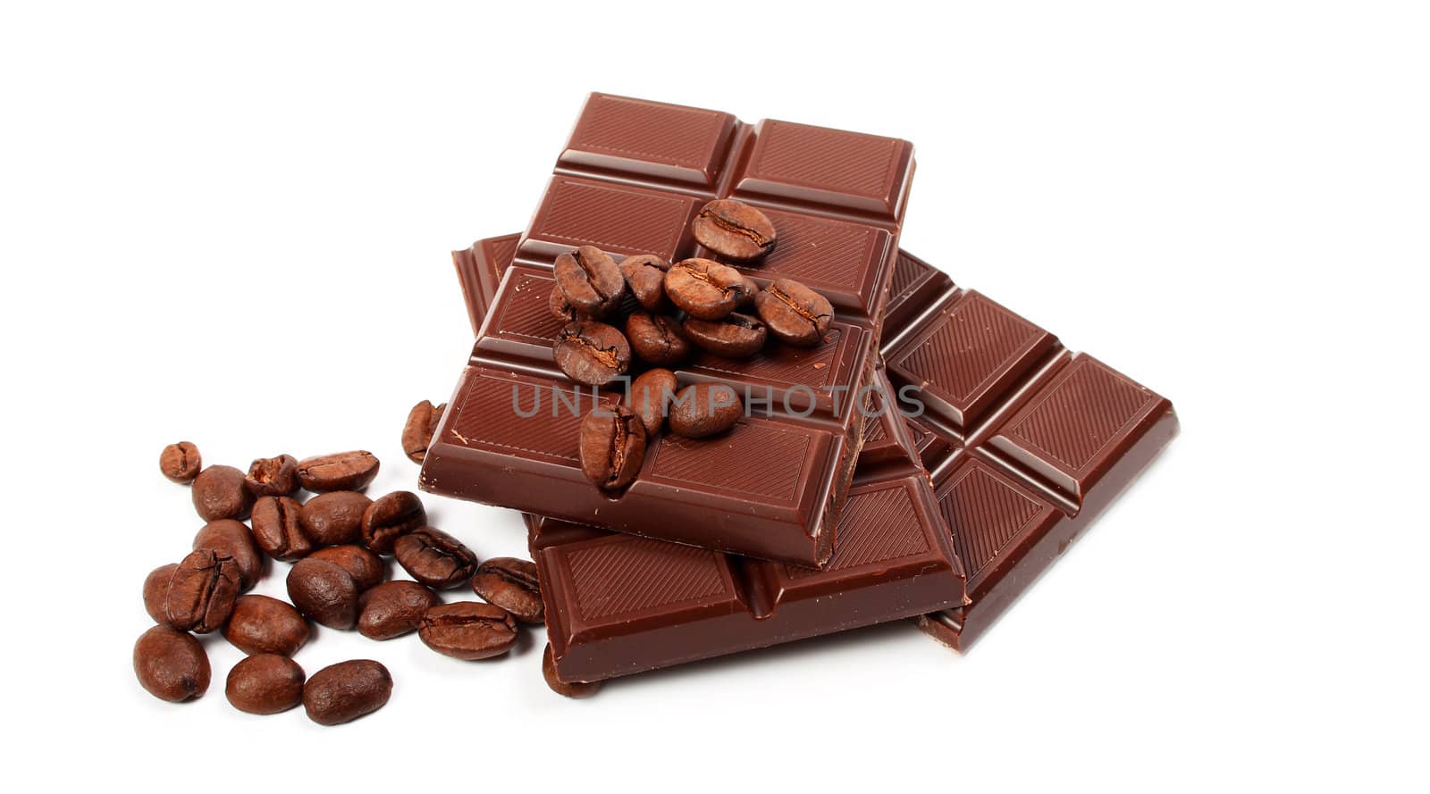 block of chocolate and coffe seeds isolated over white