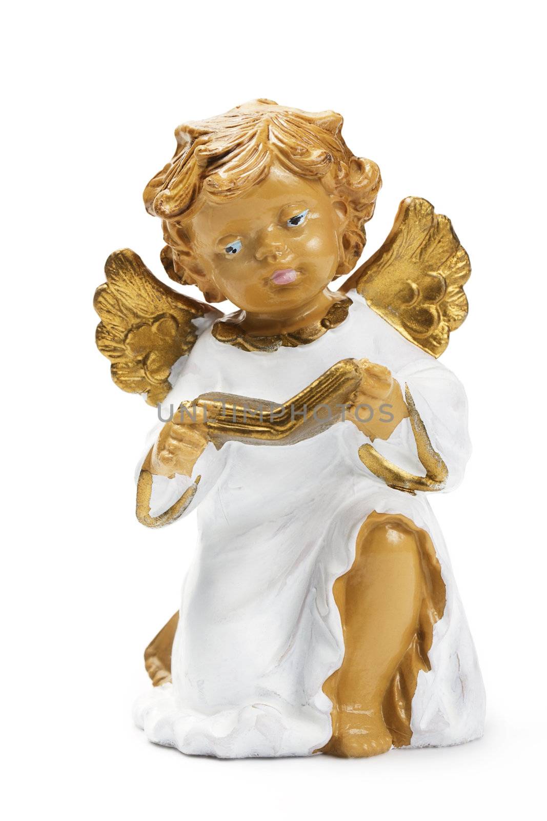 white and golden christmas angel figurine reading book on white background