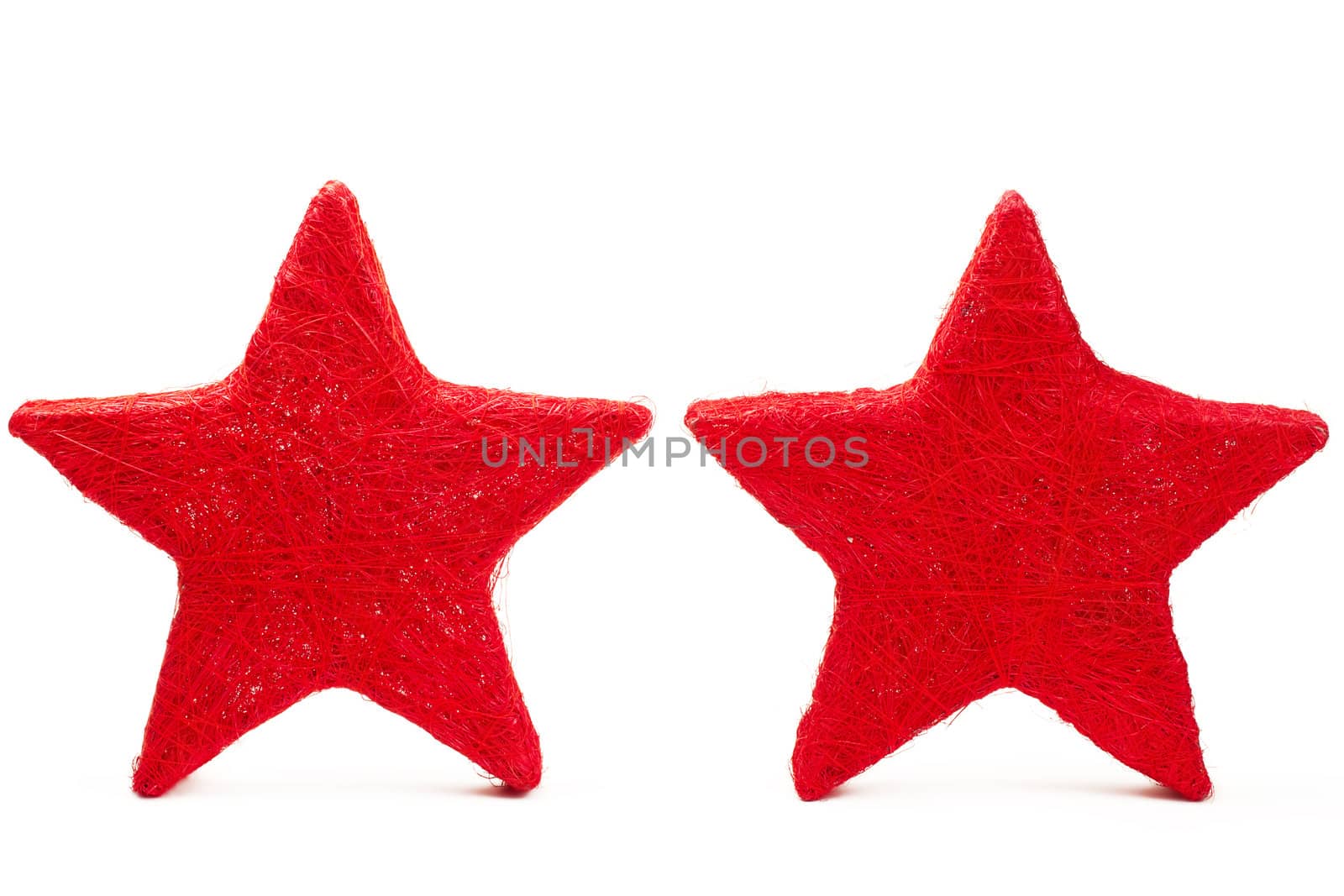 two red thread stars standing on white background