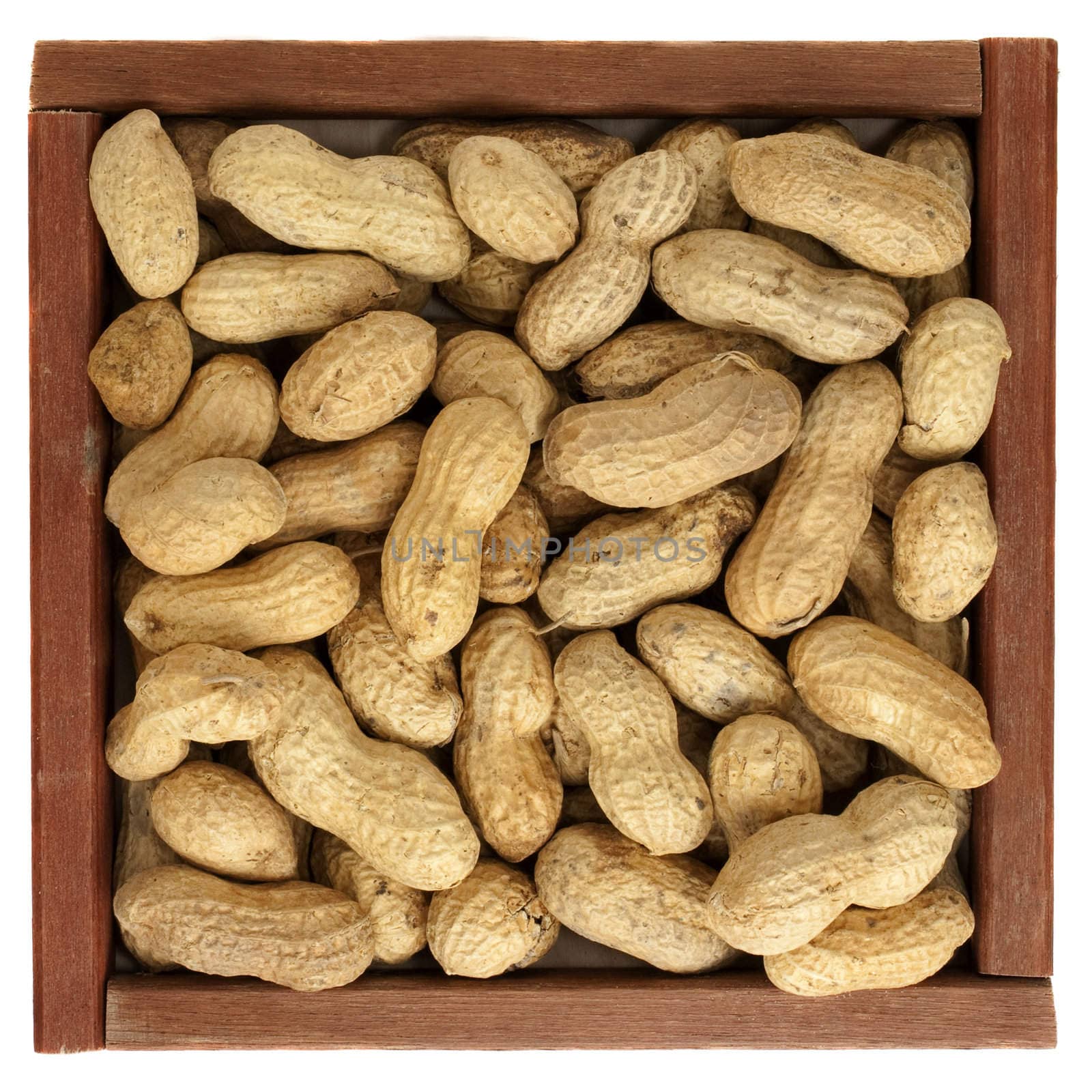 peanuts in a rustic, wooden box by PixelsAway