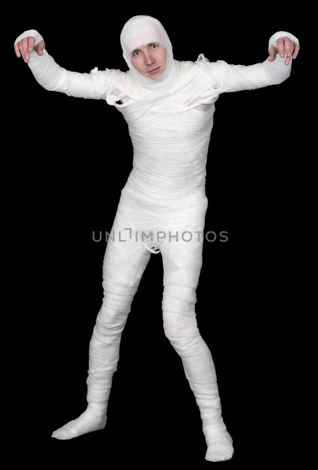 The mummy in bandage upright on a black background